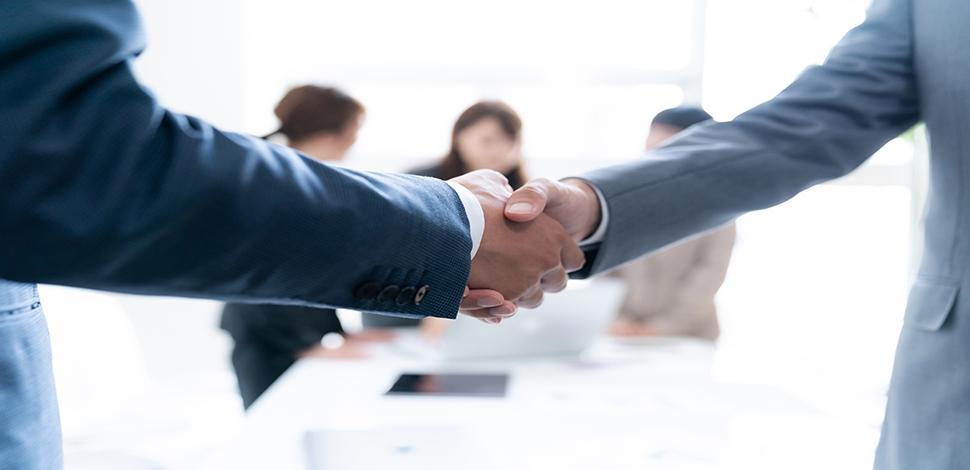 business persons shaking hand on the white background